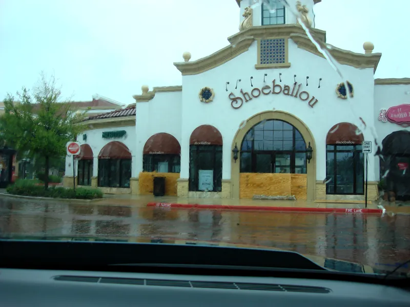 Shoeballou store on Market Street with plywood over the windows Shoeballou store on Market Street with plywood over the windows during Hurricane Ike