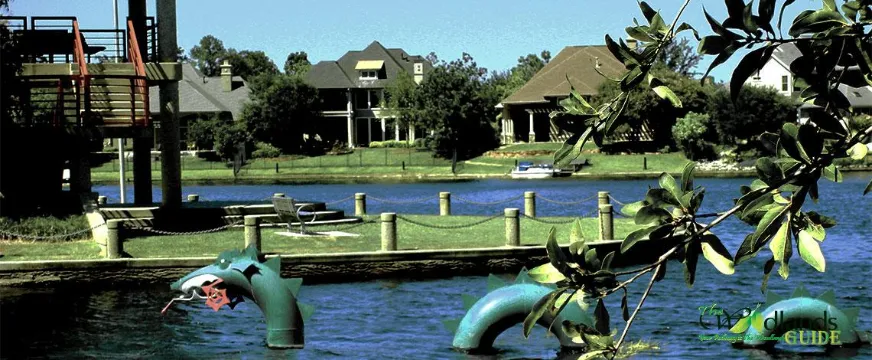 Southshore Park The Woodlands Panther Creek Village Rise of the Midgard Serpent sculpture in Lake Woodlands at Southshore Park, Village of Panther Creek