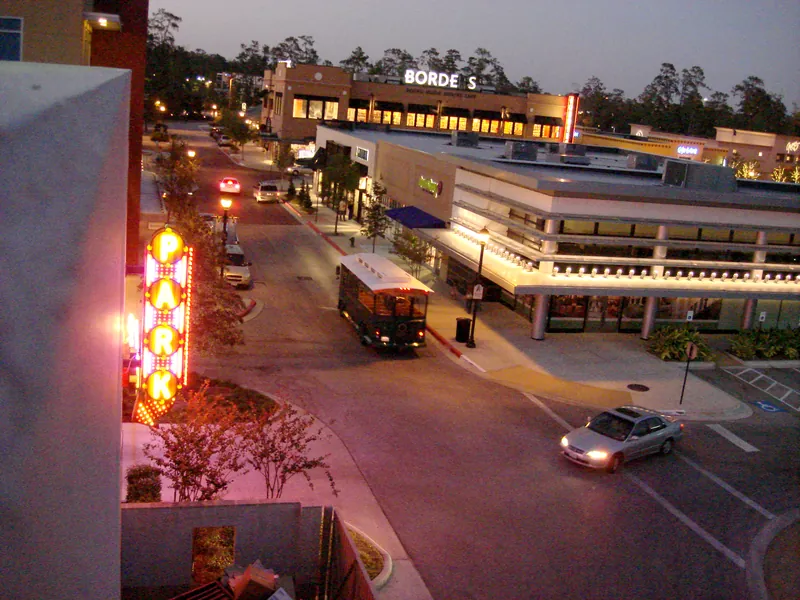 Town Center trolley on a lit street at dusk two weeks Town Center trolley on a lit street at dusk two weeks after Hurricane Ike